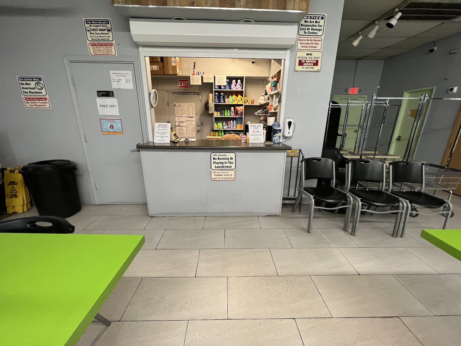 Service counter with detergent supplies for sale and seating area